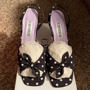 Caparros black & white polka dot slingbacks.